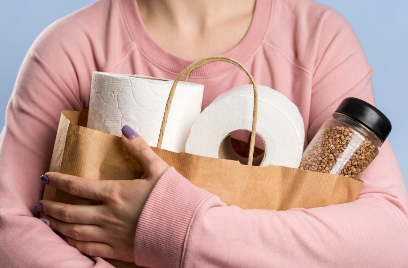 Household essentials deals with paper goods and pantry basics stocked using monthly savings strategies.